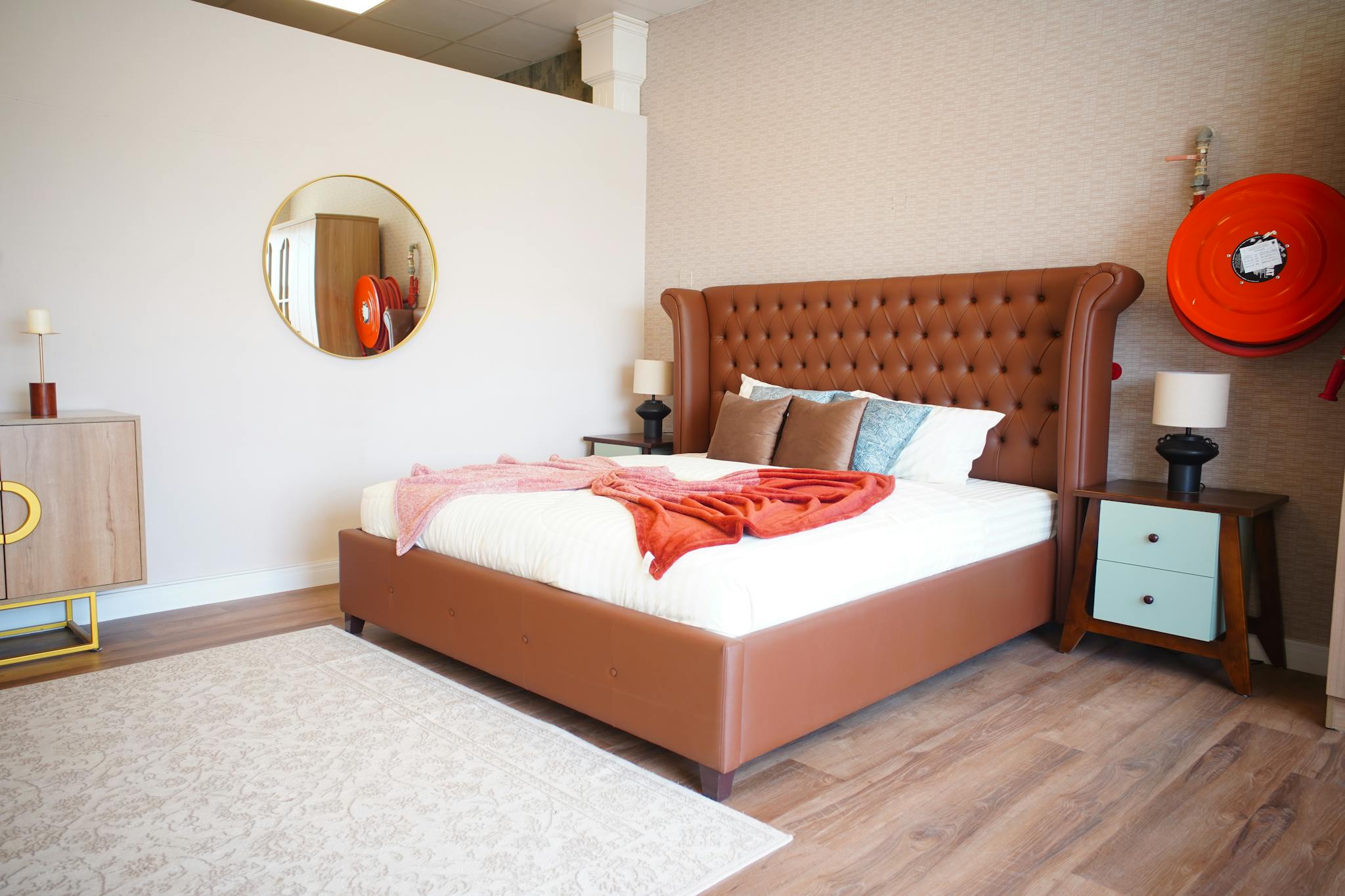 Sophisticated modern bedroom featuring luxury furniture and warm tones in Ajman, UAE.