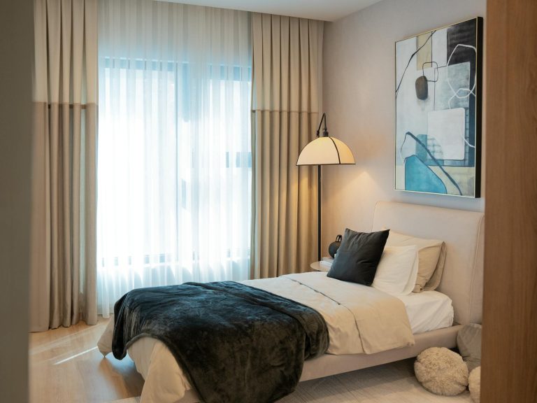 Stylish bedroom with modern design and cozy lighting.